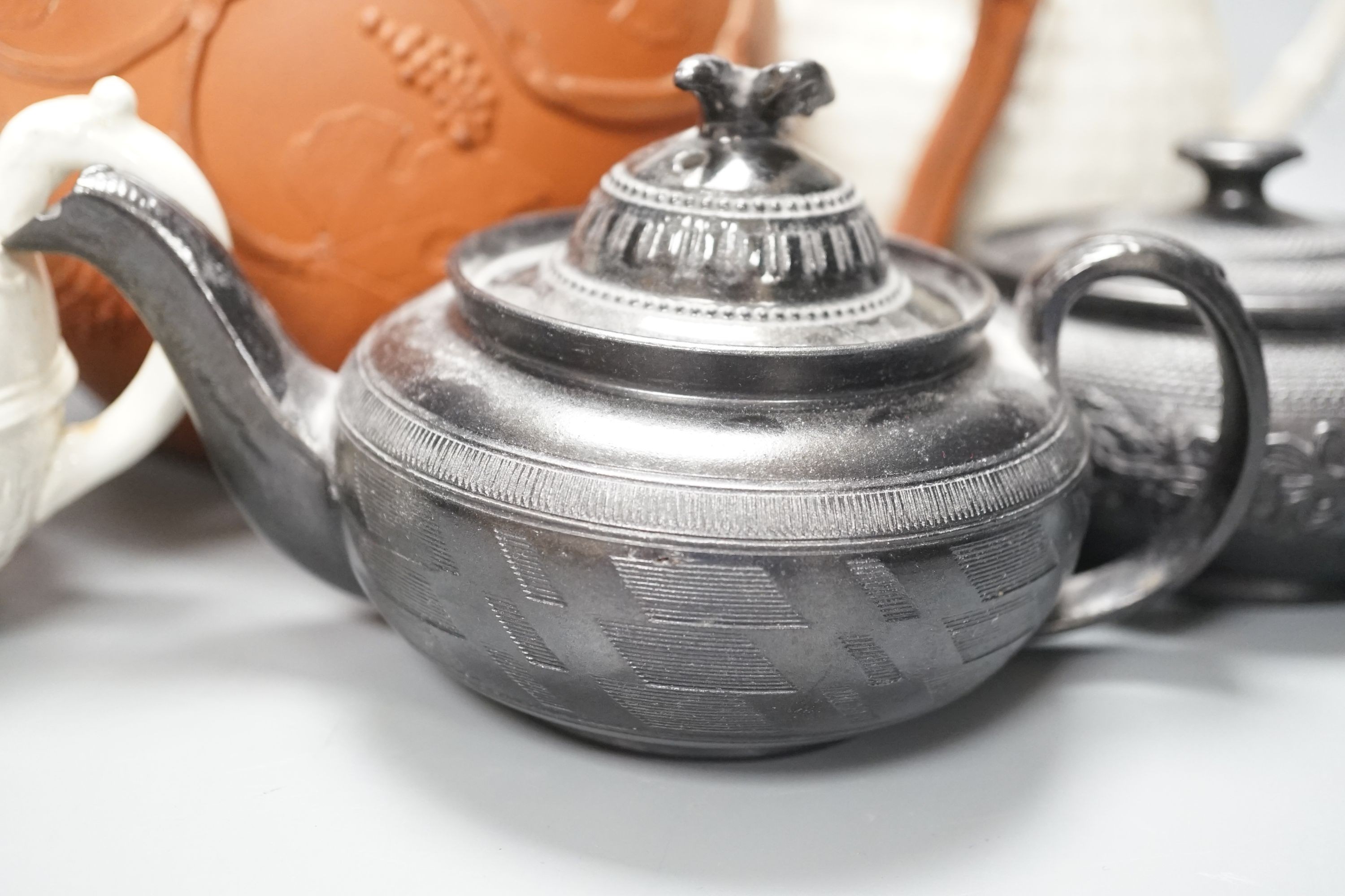 Four 19th century black basalt or black glazed pottery teapots, a large red ware teapot, a creamware dish and a Royal Worcester pot pourri, and other ceramics, tallest 27.5cm